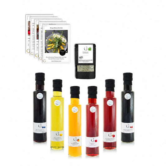 Buntes Bestseller Salatdressing Sparset von Genial Genießen mit verschiedenen Essig- und Ölkreationen in Glasflaschen, ideal für Salate und Dressings.