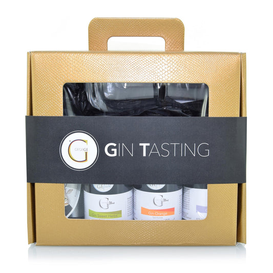 Gin Tasting Geschenkset von Genial Genießen mit drei aromatischen Ginsorten (Gin Classic, Gin Orange und Gin Sweet Herbs) sowie Wasabi-Erdnüssen in edler Koffer-Geschenkverpackung für ein genussvolles Tasting-Erlebnis.