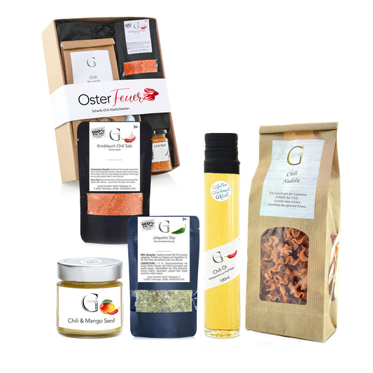 Hochwertiges Oster-Geschenkset von Genial Genießen mit feinen Likören, Schokolade und Feinkostspezialitäten, stilvoll arrangiert als Geschenkidee für das Osterfest.