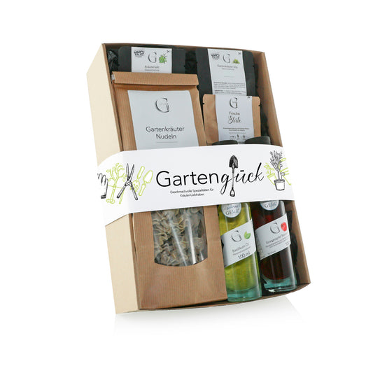 Gartenglück Geschenkset von Genial Genießen mit ausgewählten Feinkostspezialitäten wie Granatapfel Balsam, Basilikum Öl, Gartenkräuter Nudeln, Kräutertee und Kräutersalz für aromatische Genussmomente aus dem Kräutergarten.